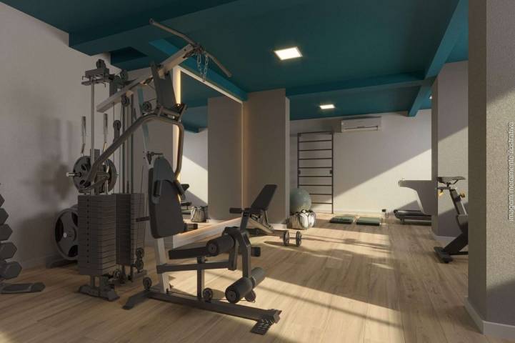 Academia com equipamentos de musculação e cardio