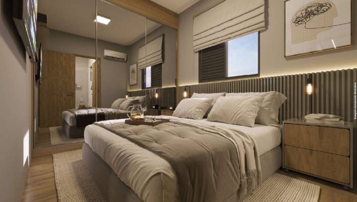 Suíte do apartamento no Liv Mansões com cama de casal e armário espelhado