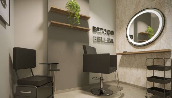 Espaço de beleza com cadeiras de atendimento e espelho iluminado