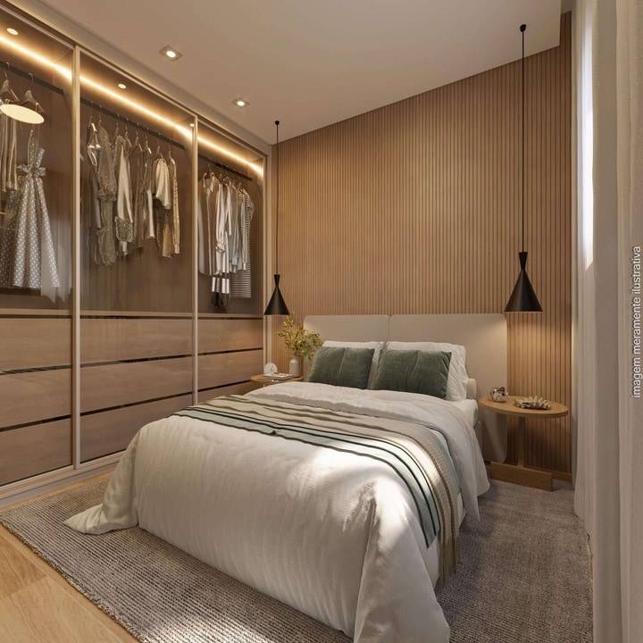 Suíte do apartamento com armários e decoração contemporânea
