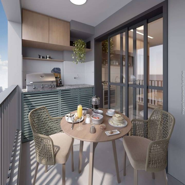 Varanda gourmet do apartamento com mesa e área de convivência